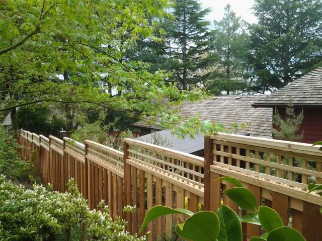 A decorative wood fence with a lattice top section, installed by Clark County Fence LLC in Vancouver, WA.