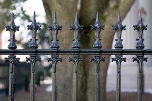Close-up of decorative wrought iron fence finials, showcasing craftsmanship by Fence Company Chicago in Chicago, IL