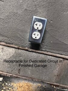 A newly installed electrical receptacle for a dedicated circuit in a finished garage by Fuse Electrical LLC in Rochester, NY