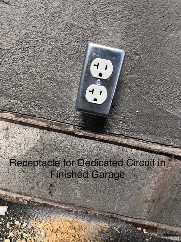 A newly installed electrical receptacle for a dedicated circuit in a finished garage by Fuse Electrical LLC in Rochester, NY
