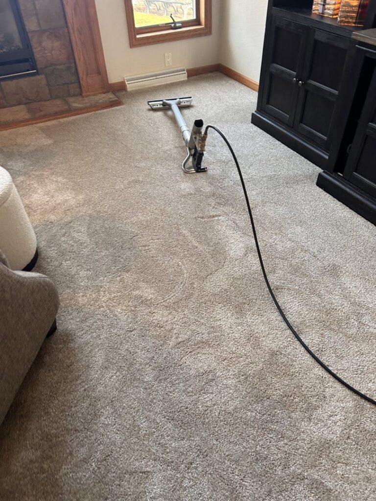 Close-up of a deep carpet cleaning process with steam, performed by Green Bay Carpet Cleaning in Green Bay, WI.