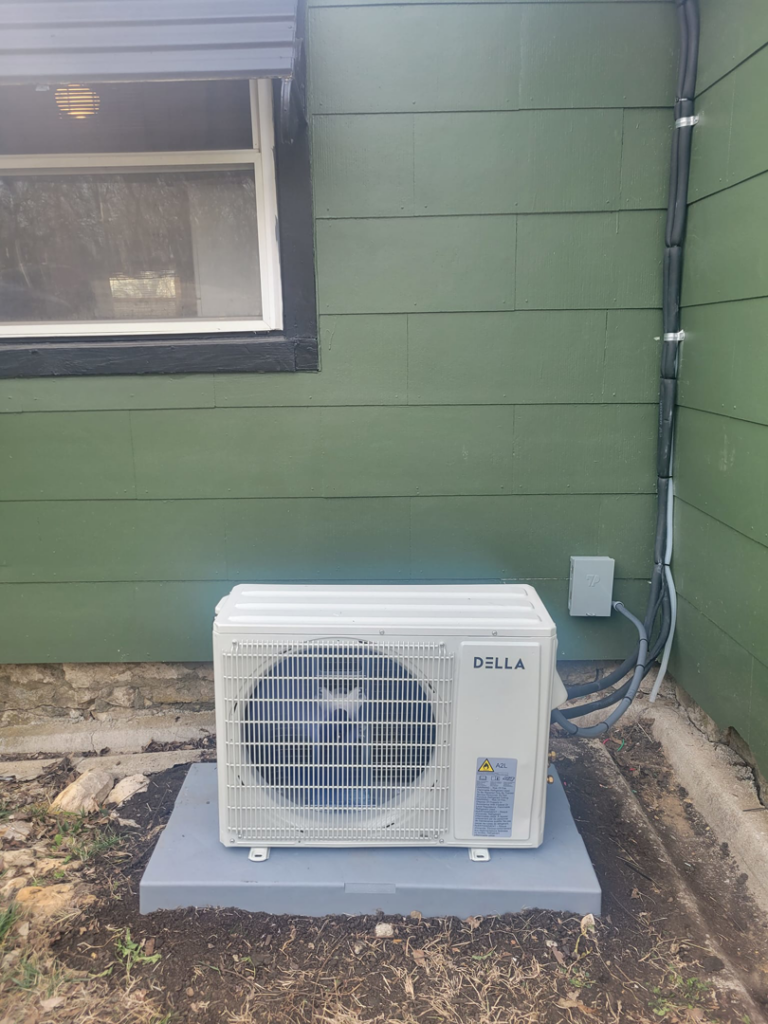 An outdoor Della mini-split condenser unit installed by Vega Heating and Cooling in Kansas City, KS
