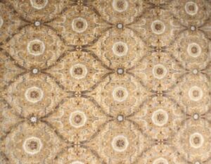 A detailed close-up of a patterned carpet available at J and J Oriental Rug Gallery in Alexandria, VA.