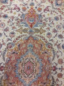 A close-up view of a detailed and colorful oriental rug pattern offered by Accents Galleria in Kansas City, MO