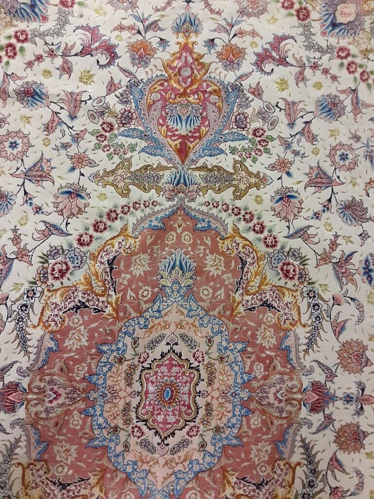 A close-up view of a detailed and colorful oriental rug pattern offered by Accents Galleria in Kansas City, MO