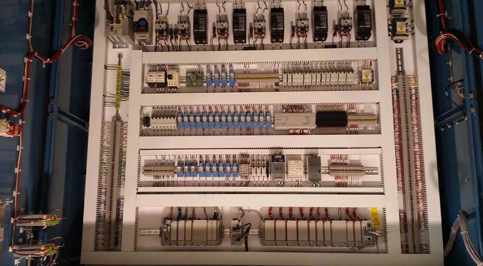 A detailed view of neatly organized wiring and components inside an electrical control panel by D-America Electrical Contractor LLC in Passaic, NJ.