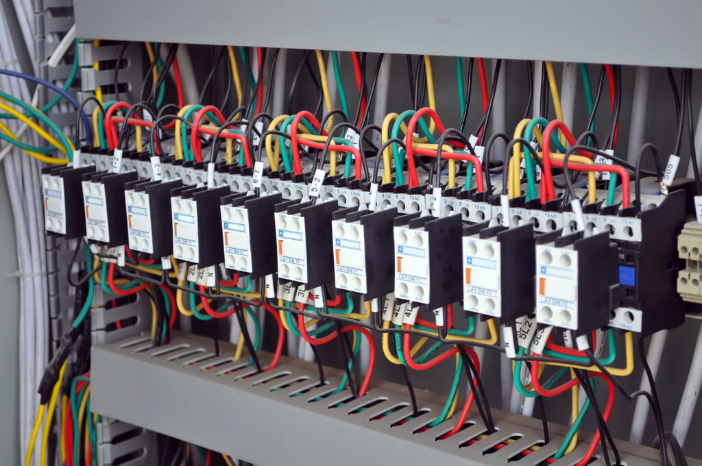 Detailed view of organized electrical wiring and components within a control panel, installed by TJS Electrical Services Inc in Mesa, AZ.