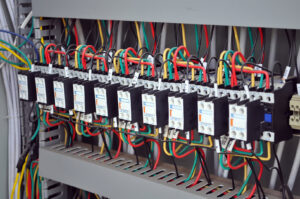 Detailed view of organized electrical wiring and components within a control panel, installed by TJS Electrical Services Inc in Mesa, AZ.