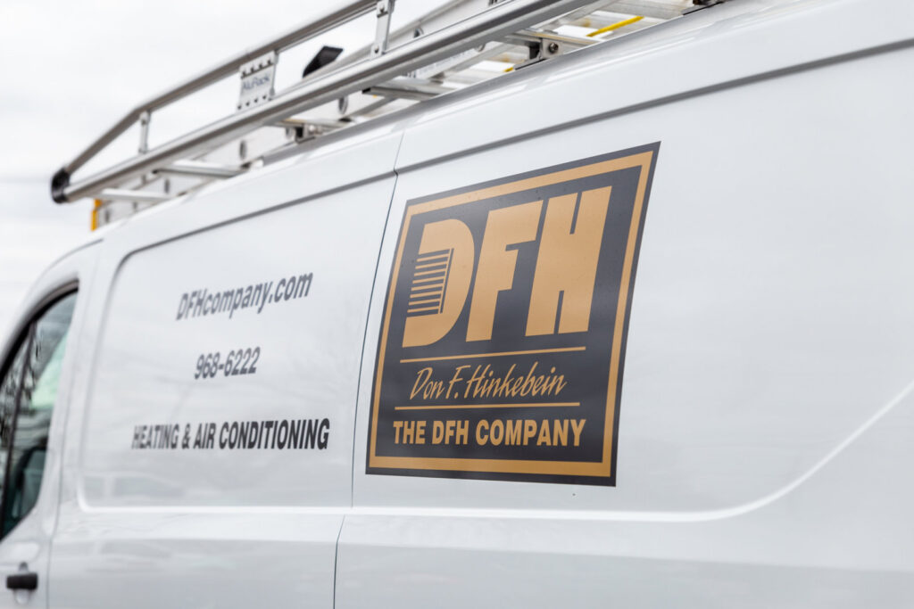 A white DFH Company Heating and Air Conditioning service van with branding and contact details in Louisville, KY.