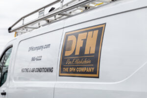 A white DFH Company Heating and Air Conditioning service van with branding and contact details in Louisville, KY.