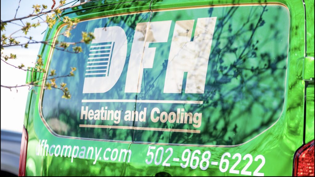The rear of a DFH Company Heating and Air Conditioning service van displaying the logo and contact information in Louisville, KY.