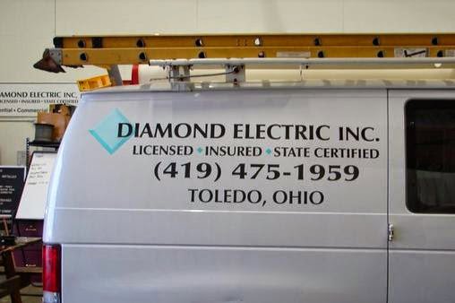 A Diamond Electric service van with a ladder on the roof rack, displaying business information in Toledo, OH.