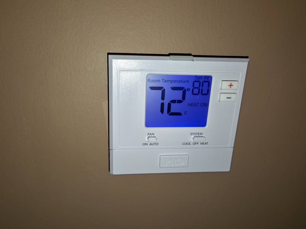 A digital thermostat displaying temperature settings, installed or serviced by Bruce Heating & Air in Kennewick, WA.