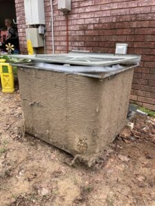 A very old and dilapidated outdoor HVAC unit, indicating a need for inspection or replacement services by DeltaCool in Jonesboro, AR.