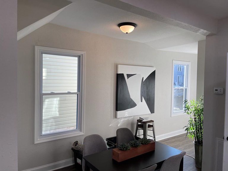 A dining area with a modern flush mount ceiling light installed by Denny Power Solutions in Virginia Beach, VA