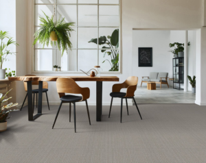 A stylish dining area showcasing light grey patterned carpet installed by AFS Flooring West Jordan in West Jordan, UT.