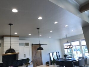 Modern dining area featuring stylish pendant and recessed lighting installed by Veritas Electric in Yalaha, FL.