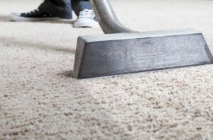 A freshly cleaned carpet in a dining room, ready for use, by ProTech Carpet Care in Greensboro, NC.