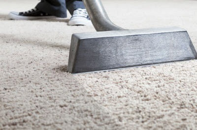 A freshly cleaned carpet in a dining room, ready for use, by ProTech Carpet Care in Greensboro, NC.