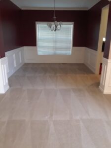 A dining room with freshly cleaned carpet showing cleaning lines by Advanced Carpet Cleaning in College Station, TX