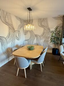 A modern chandelier installed over a dining room table by Flavin Electric, LLC in Chicago, IL