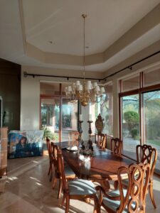 A large chandelier installed in a dining room by GET LIT Electrical Services LLC in Glendale, AZ.