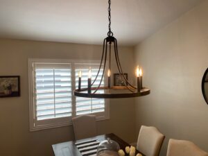 A stylish chandelier installed in a dining room by Pro Solutions Electric in Glendale, AZ.