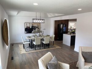 Dining room featuring a modern chandelier and recessed lighting installed by Innovative Electric in Wichita, KS.