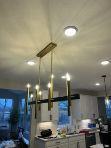 A stylish dining room chandelier and recessed lighting installed by Heritage Electric LLC in Indianapolis, IN.