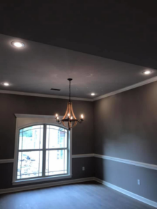 Dining room featuring a decorative chandelier and recessed lighting installed by JMD Electric, LLC in O'Fallon, MO.