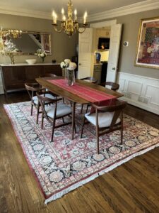 A beautifully decorated dining room featuring an oriental rug from J and J Oriental Rug Gallery in Alexandria, VA.