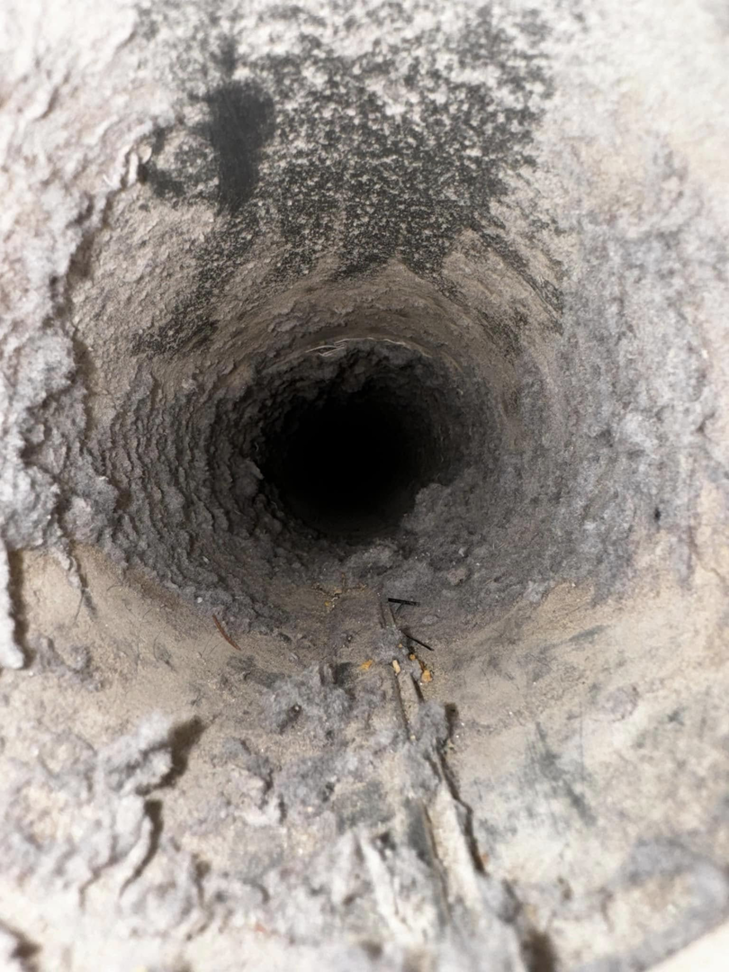 A view inside a dirty air duct, indicating the need for cleaning services from Air Ducts Heating & Air in Dayton, OH.