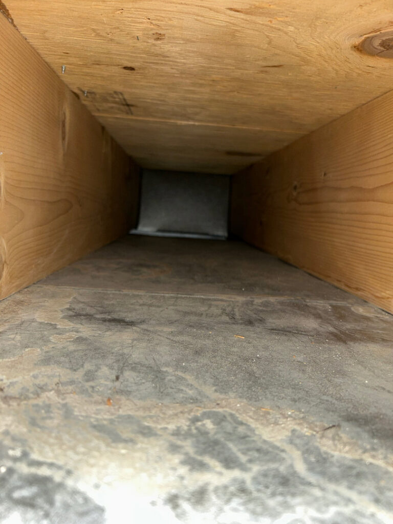 An interior view of a dirty air duct, indicating a need for cleaning by Primary Air Home Services in Aurora, CO.