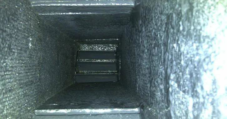 A very dirty air duct interior before cleaning service by Purair Hawaii in Honolulu, HI.