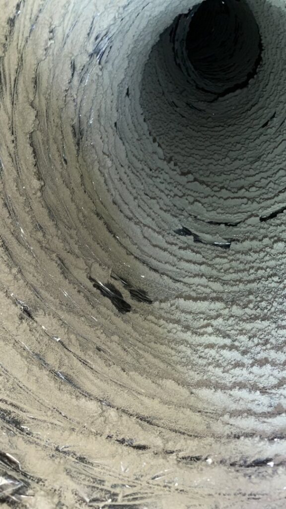The interior of a very dirty air duct, showing the need for HVAC cleaning services from EZ Comfort Air Conditioning & Heating LLC in Humble, TX.