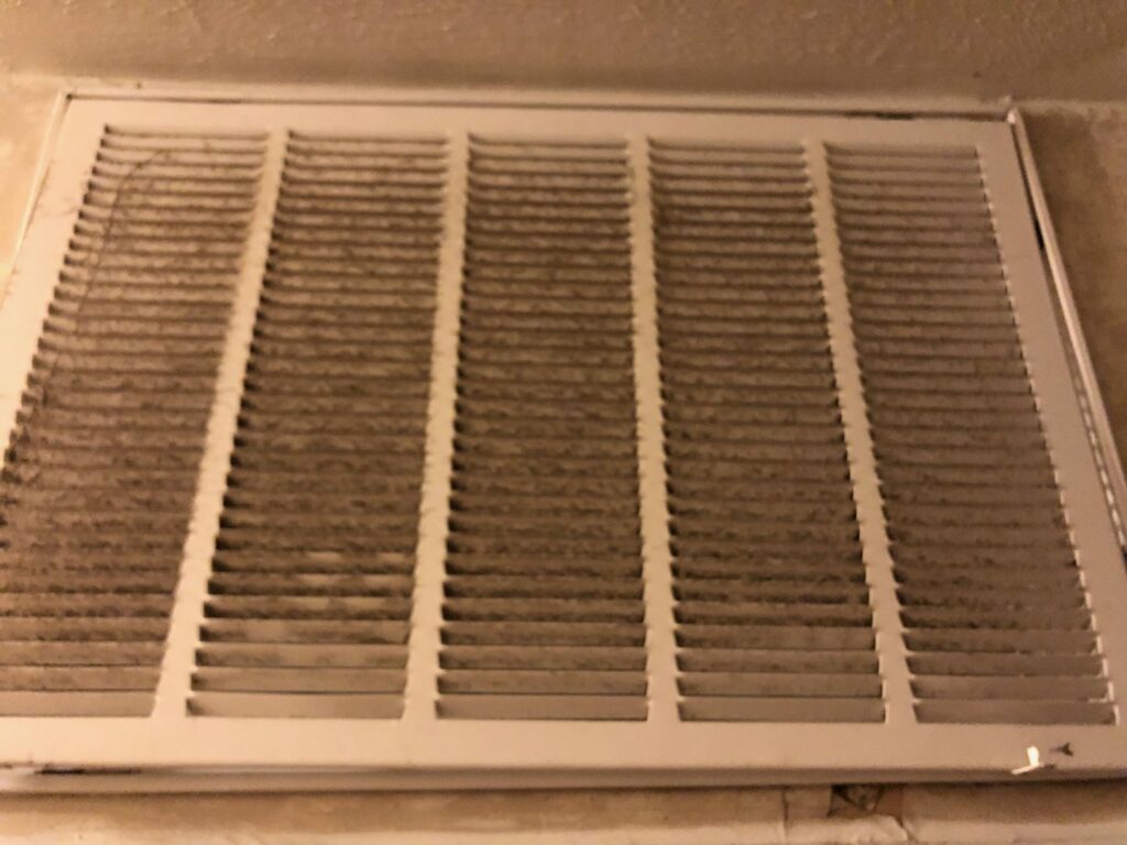 A dirty air return vent, indicating the need for HVAC maintenance from G&G Heating and Air in Portage, MI.