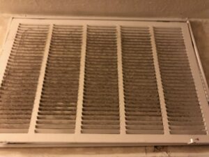 A dirty air return vent, indicating the need for HVAC maintenance from G&G Heating and Air in Portage, MI.