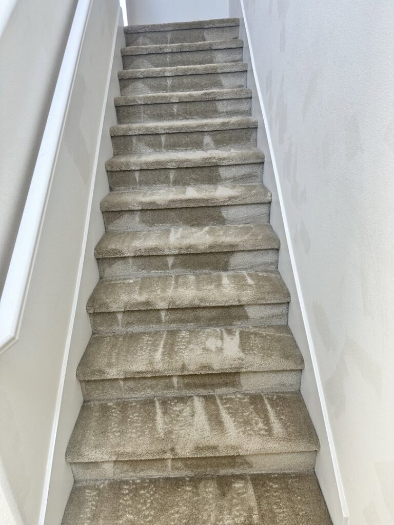 A clear before and after view of dirty and clean carpeted stairs by Mexsteam in San Diego, CA