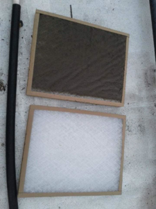 A comparison of a dirty and a clean HVAC air filter, demonstrating maintenance by Applied Mechanical Solutions in Hazelwood, MO.