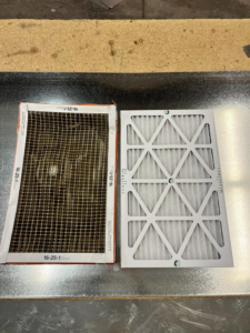 A dirty, used HVAC air filter next to a clean, new filter, demonstrating filter replacement service by Four Season Heating & Cooling in Saint Joseph, MO.