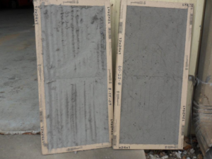A comparison of a dirty and a clean HVAC air filter, demonstrating maintenance services by Gulf Coast Ac in Saraland, AL