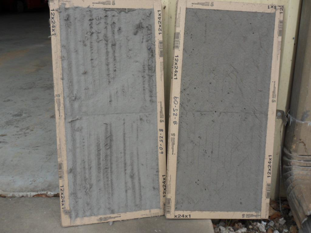 A comparison of a dirty and a clean HVAC air filter, demonstrating maintenance services by Gulf Coast Ac in Saraland, AL