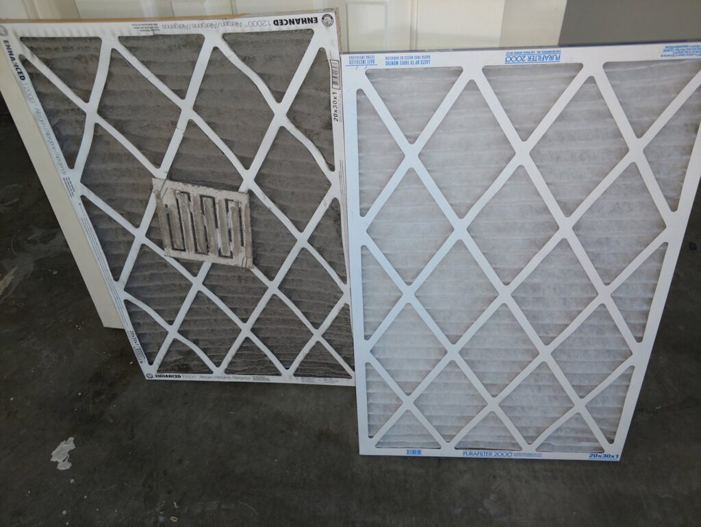 A room showing a large area of dirty carpet next to tile flooring before cleaning by Raysco, Inc. in Las Vegas, NV.