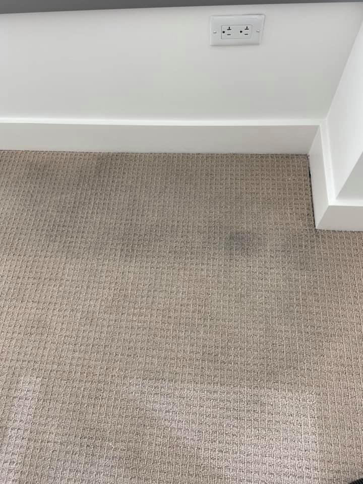 A close-up of a dirty carpet with visible stains before cleaning by Baymist Carpet Cleaning & Repair in Spokane, WA.