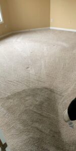 A dirty carpet in a room, before professional cleaning service by Wildcat Carpet Cleaning in Nicholasville, KY.