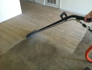Before and after comparison of a dirty, stained carpet transformed to clean by Alpine Carpet Care in Medford, OR.