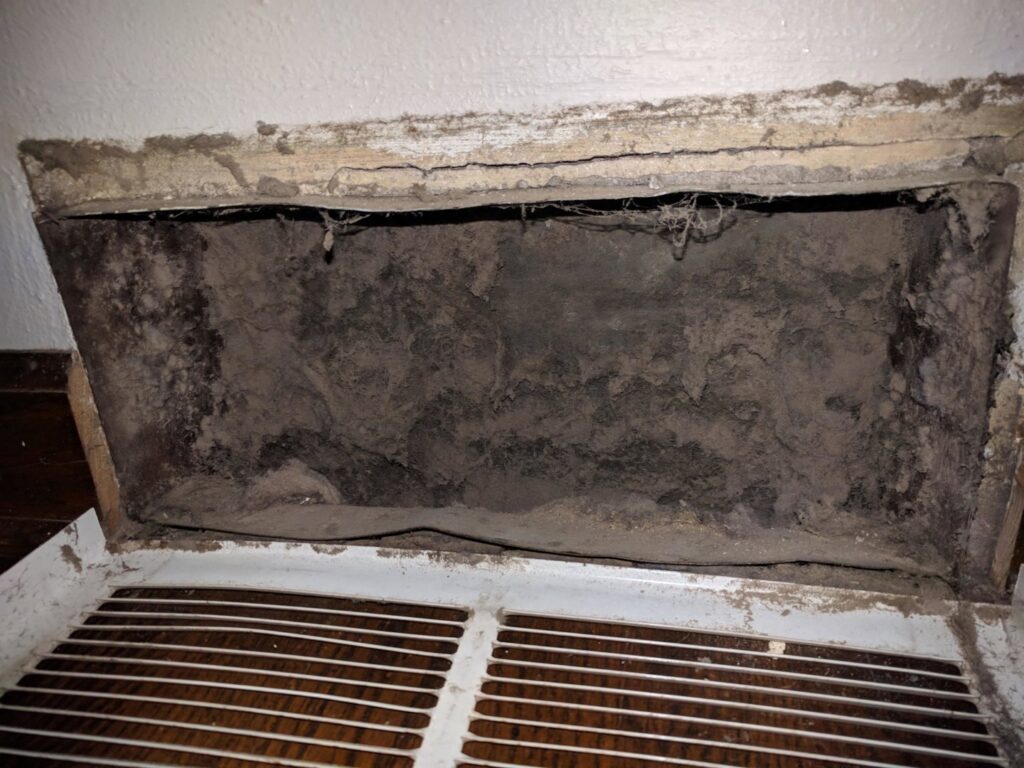 Carpeted stairs with decorative brass rods showing signs of dirt and wear, awaiting cleaning by Sears Carpet Cleaning in Cleveland, OH.