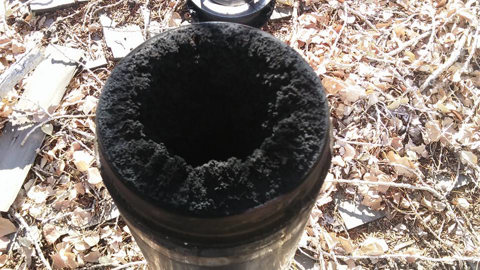 A heavily soiled chimney flue with significant creosote buildup, showing the need for sweeping by Jesse Montero in Yerington, NV.
