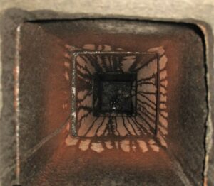 An interior view of a dirty chimney flue with significant creosote buildup, showing the need for Soot Masters Chimney Service LLC in Jackson, MS.