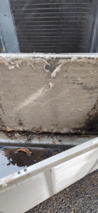 A severely dirty and clogged HVAC filter or coil requiring service from SM Heating and Cooling in Rochester, NY
